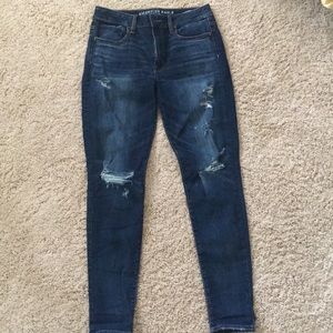 High waisted dark denim jeans with rips